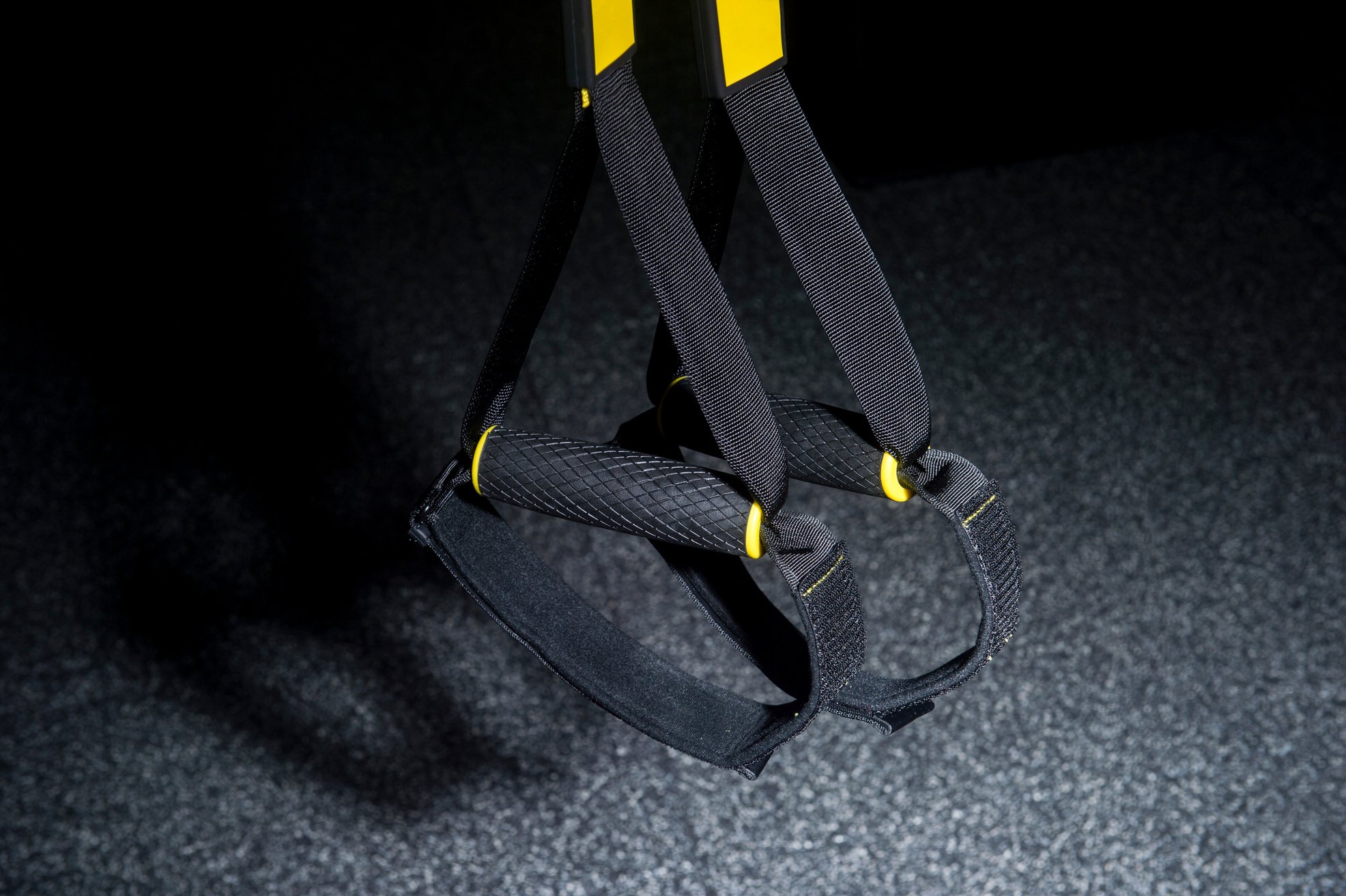 Training strap equipment. Black strap functional training equipment on grey background